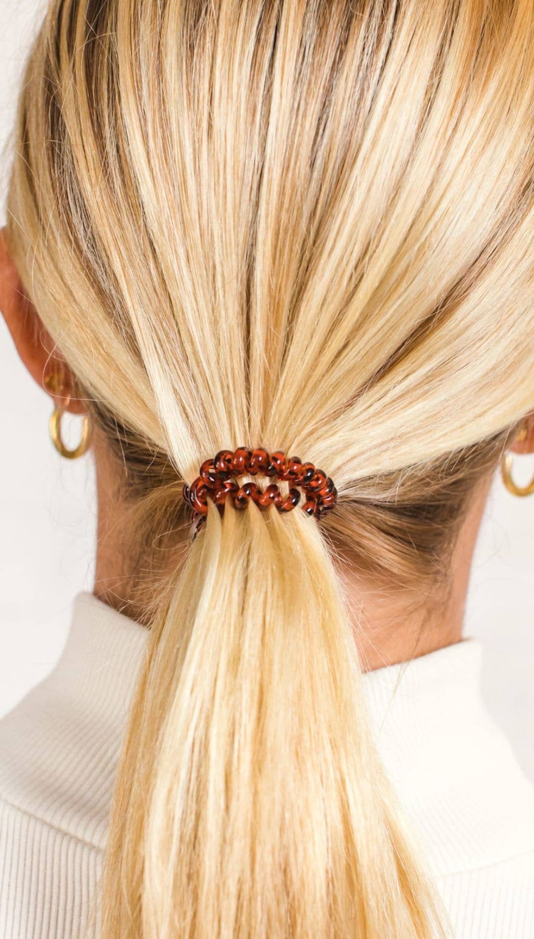Brown braided hair tie with metallic accents