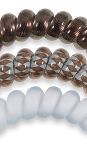 Brown and white beaded bracelet with geometric pattern, likely made of glass or ceramic beads.