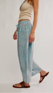 Light blue and pink vertically striped wide-leg pants with a drawstring waistband.
