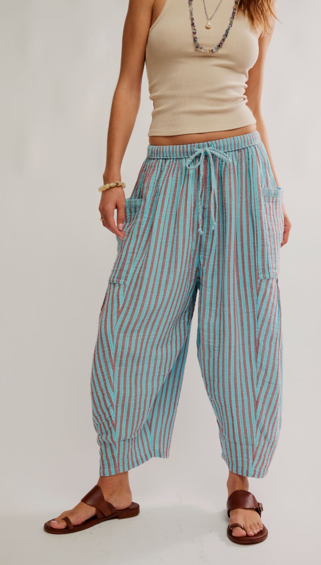 Light blue and pink striped cotton cargo pants with a drawstring waistband.