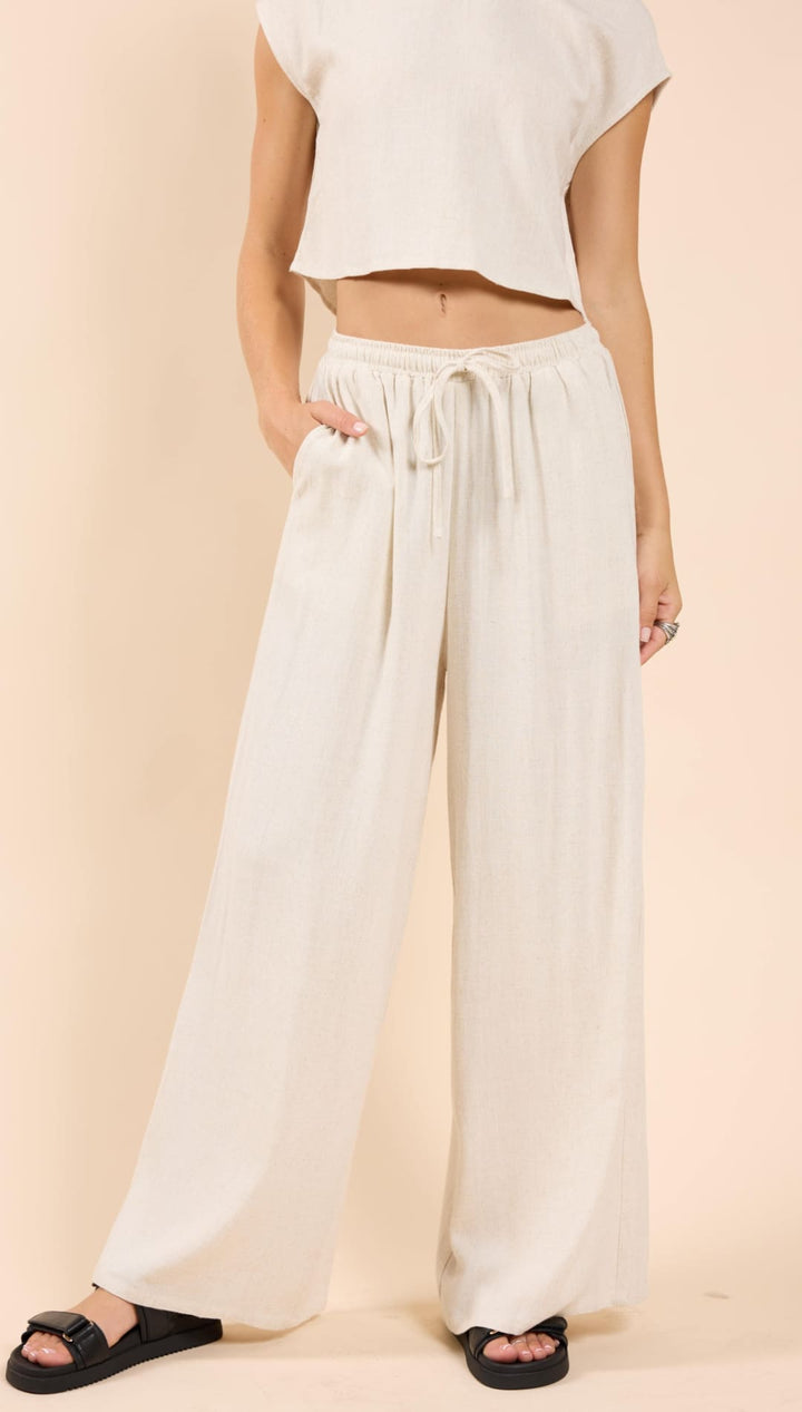 Beige wide-leg pants.