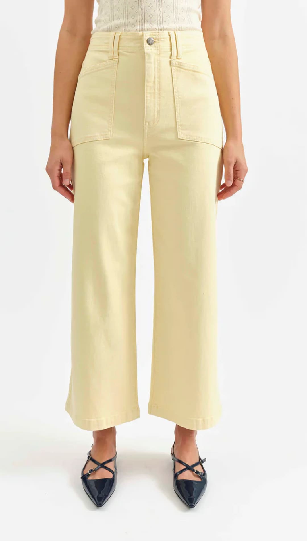 Pale yellow wide-leg pants.