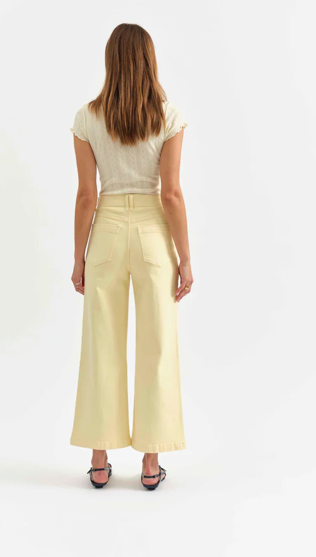 Woman in yellow wide-leg pants.