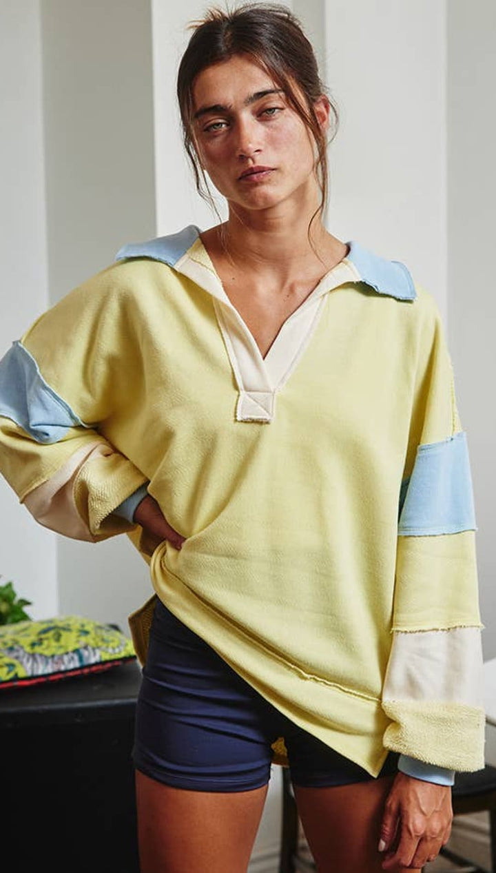 Yellow and blue color-blocked hoodie with a hood, made of soft cotton blend.