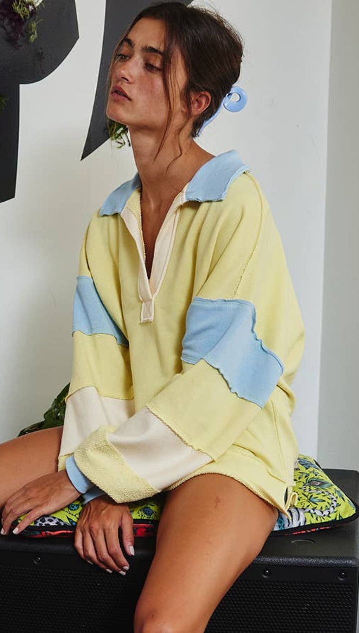 Yellow and blue patchwork jacket with a white collar, likely made of cotton or polyester blend.