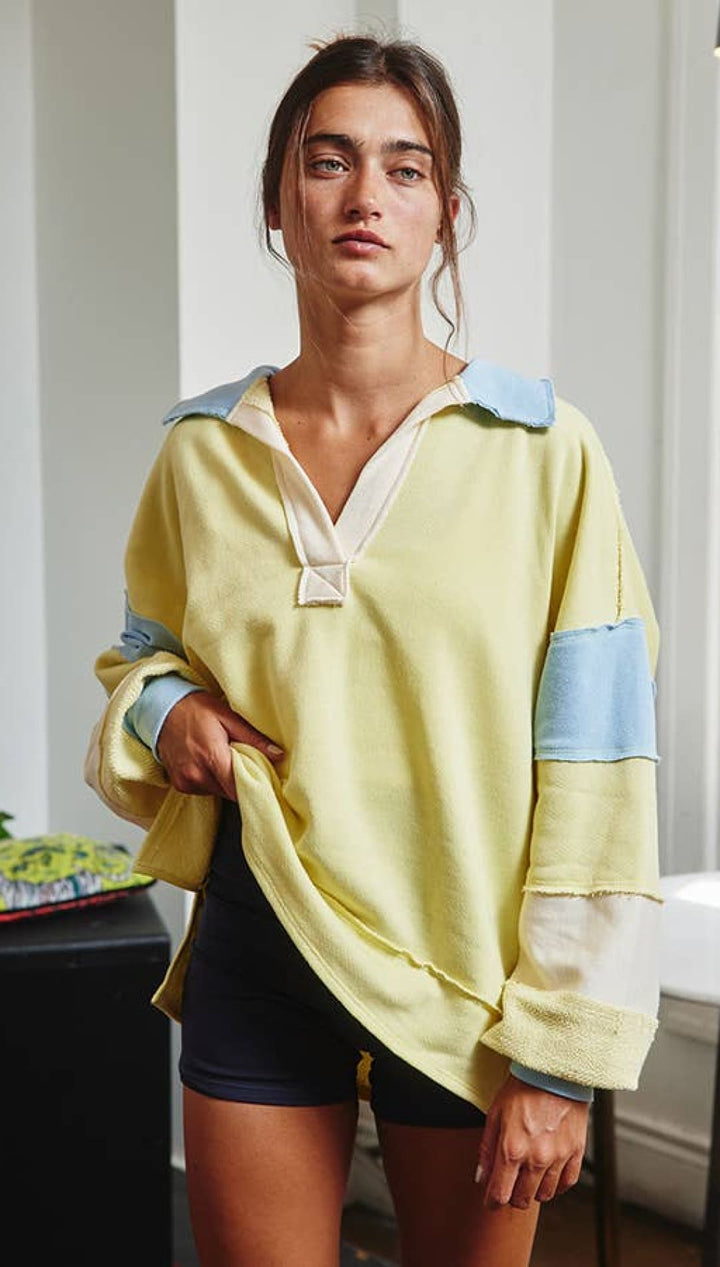 Yellow and blue patchwork hoodie with a hood, made of soft cotton.