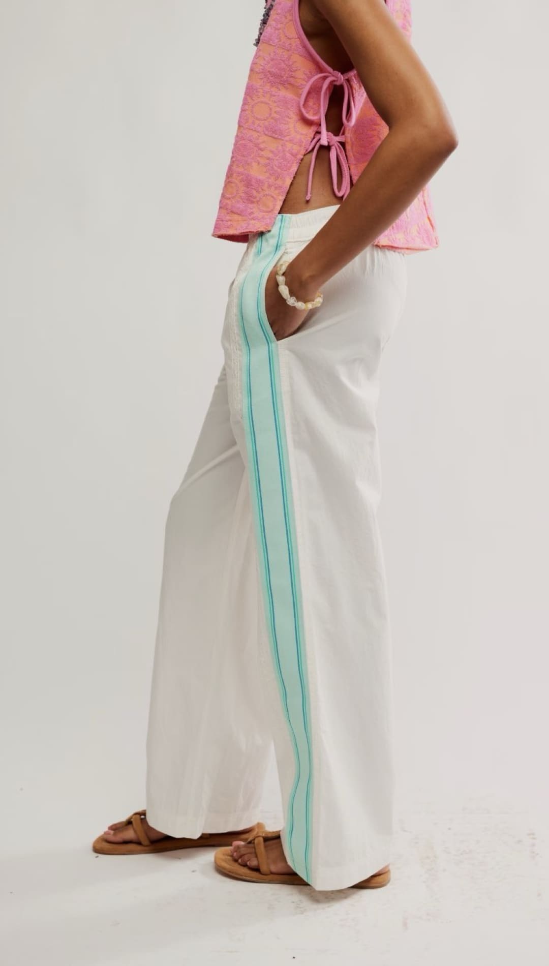 White wide-leg pants with turquoise stripe.