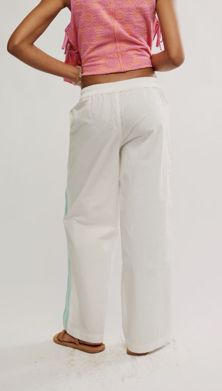 White wide-leg pants with a blue stripe.