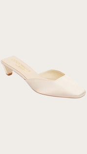 Elegant ivory mule with a low heel.