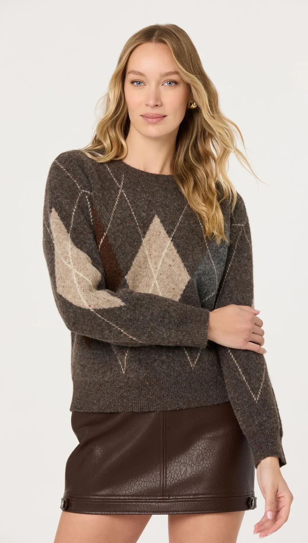 A cozy dark gray argyle sweater with beige and brown diamond patterns, crafted from a soft knit material.