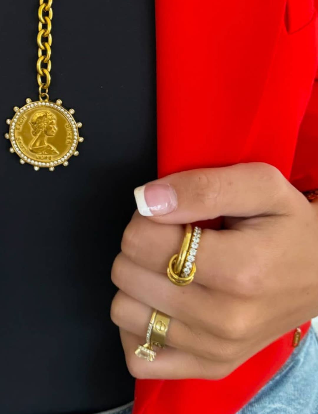 Gold coin pendant necklace with a beaded border and chain.