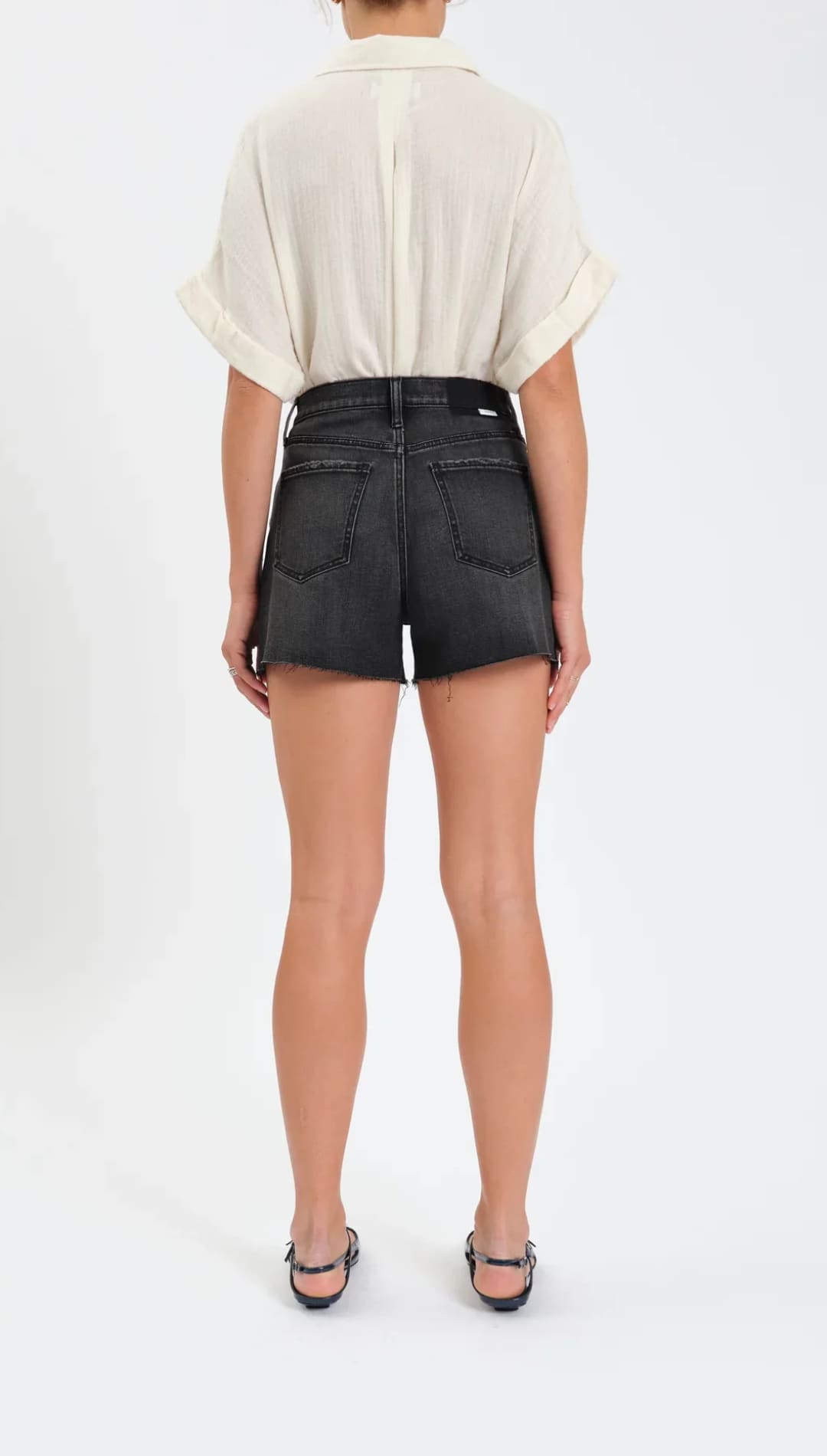 Black denim high-waisted shorts with back pockets.