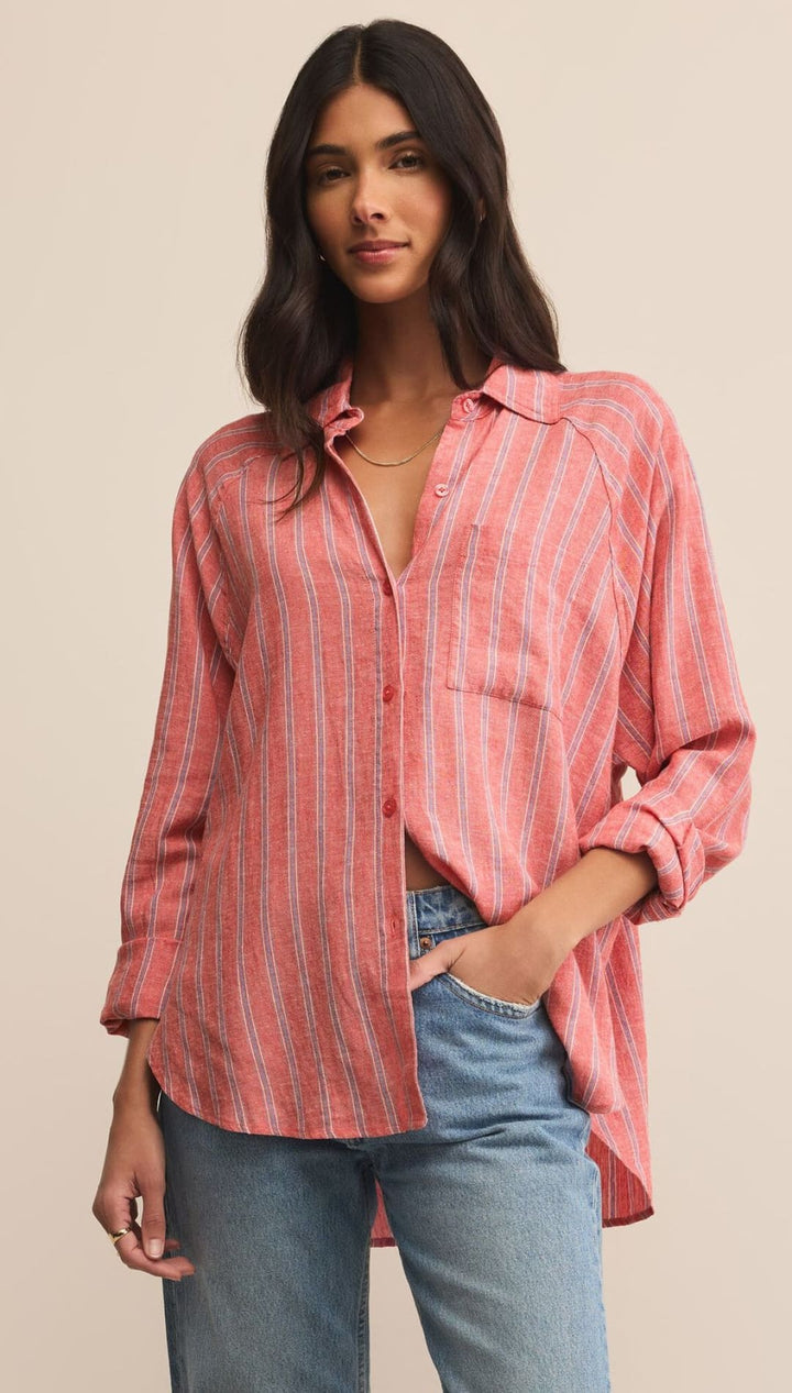 Striped, long-sleeved button-down shirt.