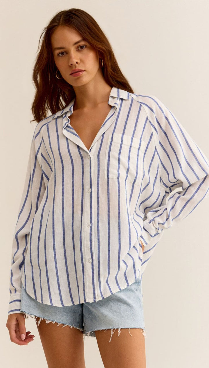 Striped, long-sleeved button-down shirt.