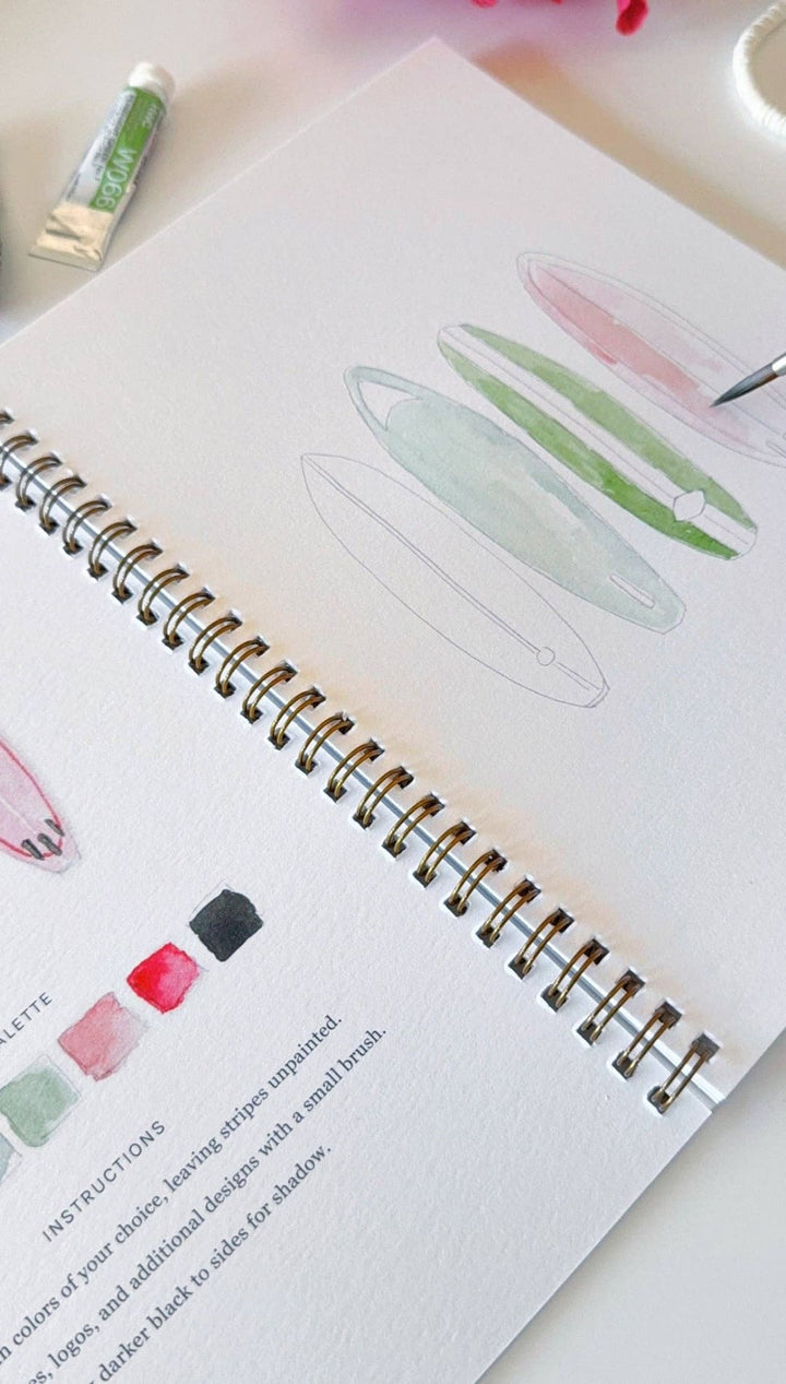 Watercolor paint palette guide book with spiral binding and pastel illustrations.