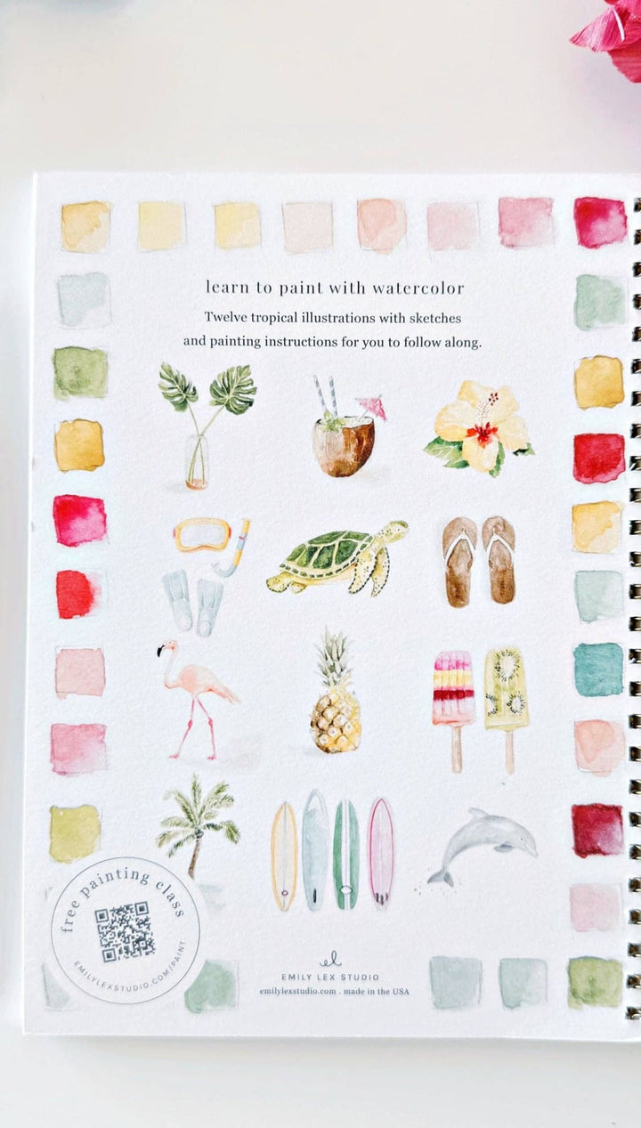 Watercolor painting book with tropical illustrations and color swatches, spiral-bound cover in white.