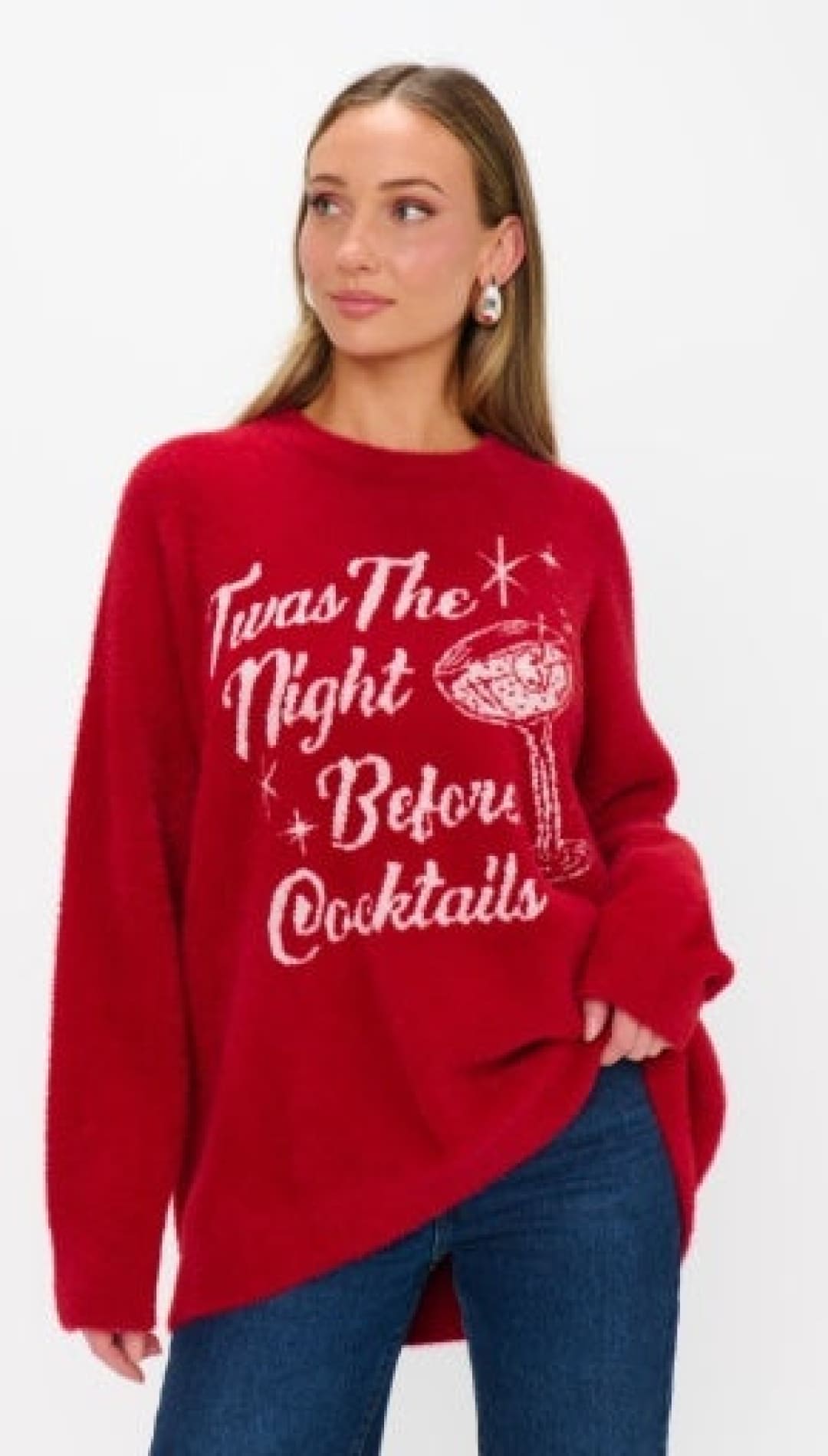 Red oversized sweater with ’twas the night before cocktails’ design and bell sleeves.