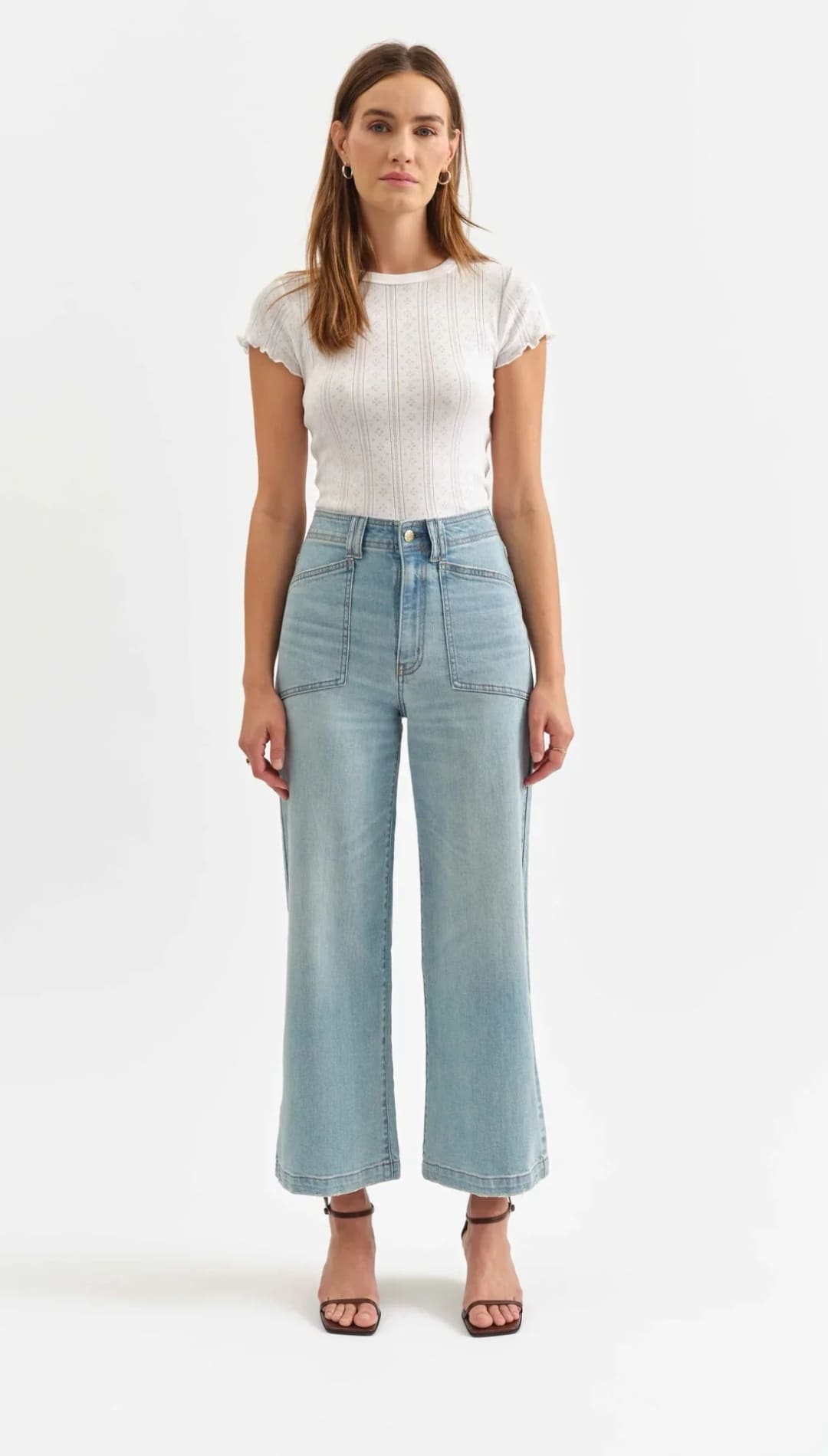 Light blue wide-leg cropped jeans paired with a fitted white t-shirt.