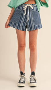 Blue and white vertically striped denim shorts with a drawstring waistband.