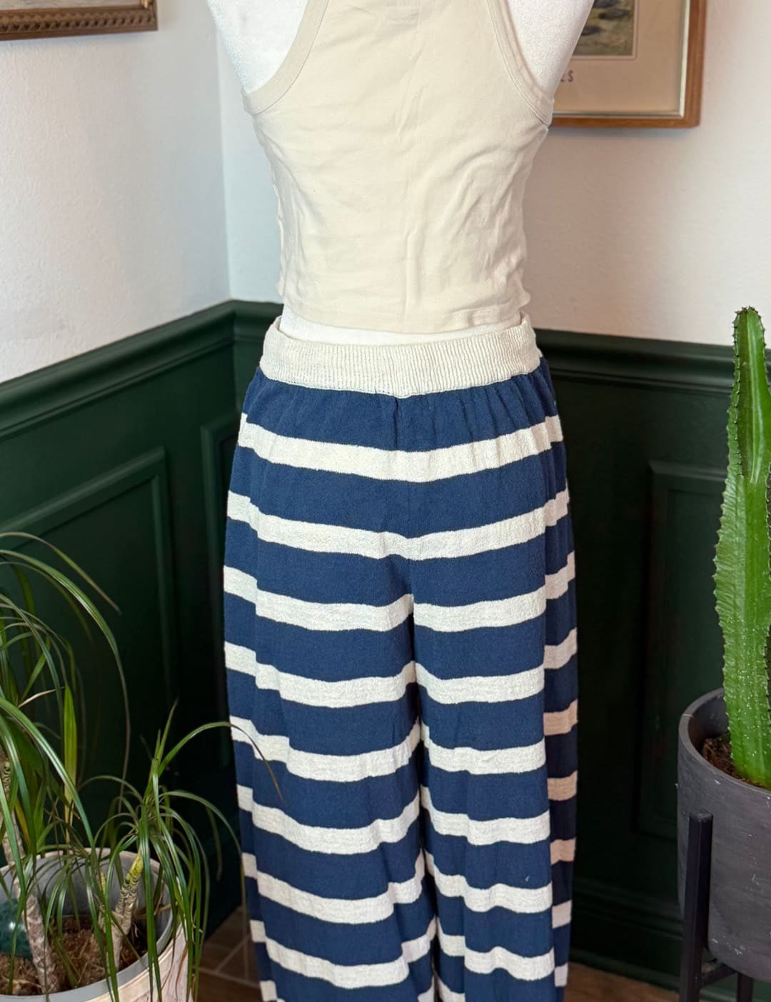 Blue and white horizontally striped wide-leg pants with a ribbed elastic waistband.