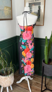 A vibrant floral print strapless dress in black with bold pink, orange, and teal blossoms.