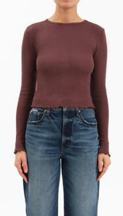 Burgundy ribbed knit sweater with high neckline and long sleeves.