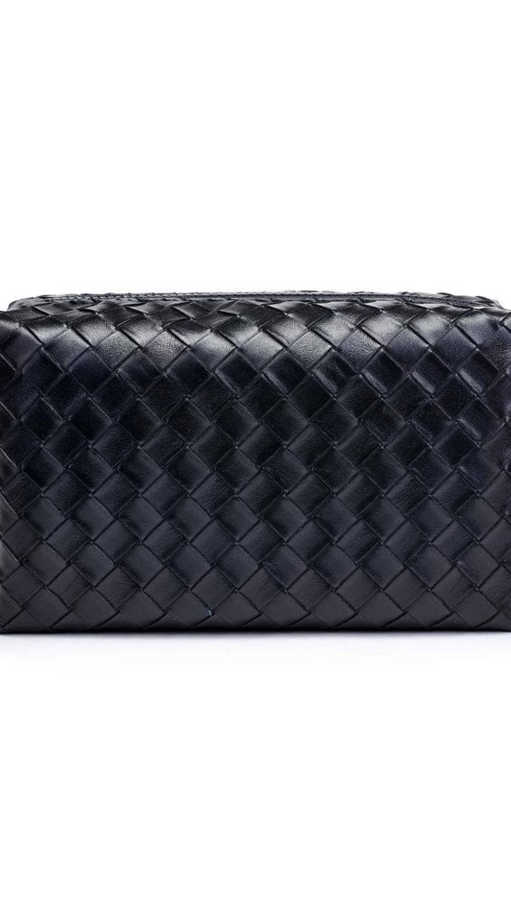 Black bottega veneta woven leather toiletry bag with zipper closure.