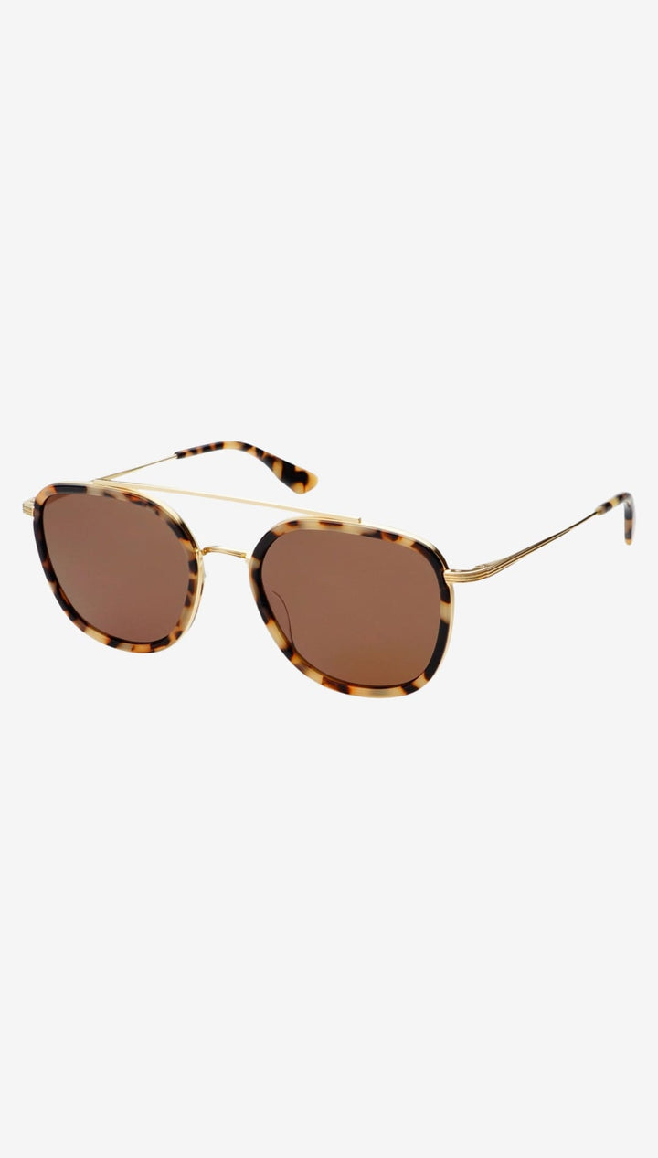 Tortoiseshell acetate frames with gold-tone metal detailing and brown gradient lenses.