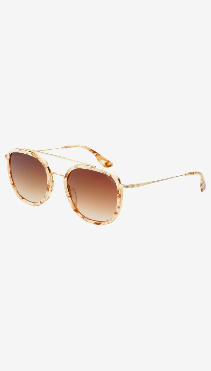 Tortoiseshell-patterned acetate sunglasses with gold-tone metal frames and gradient brown lenses.
