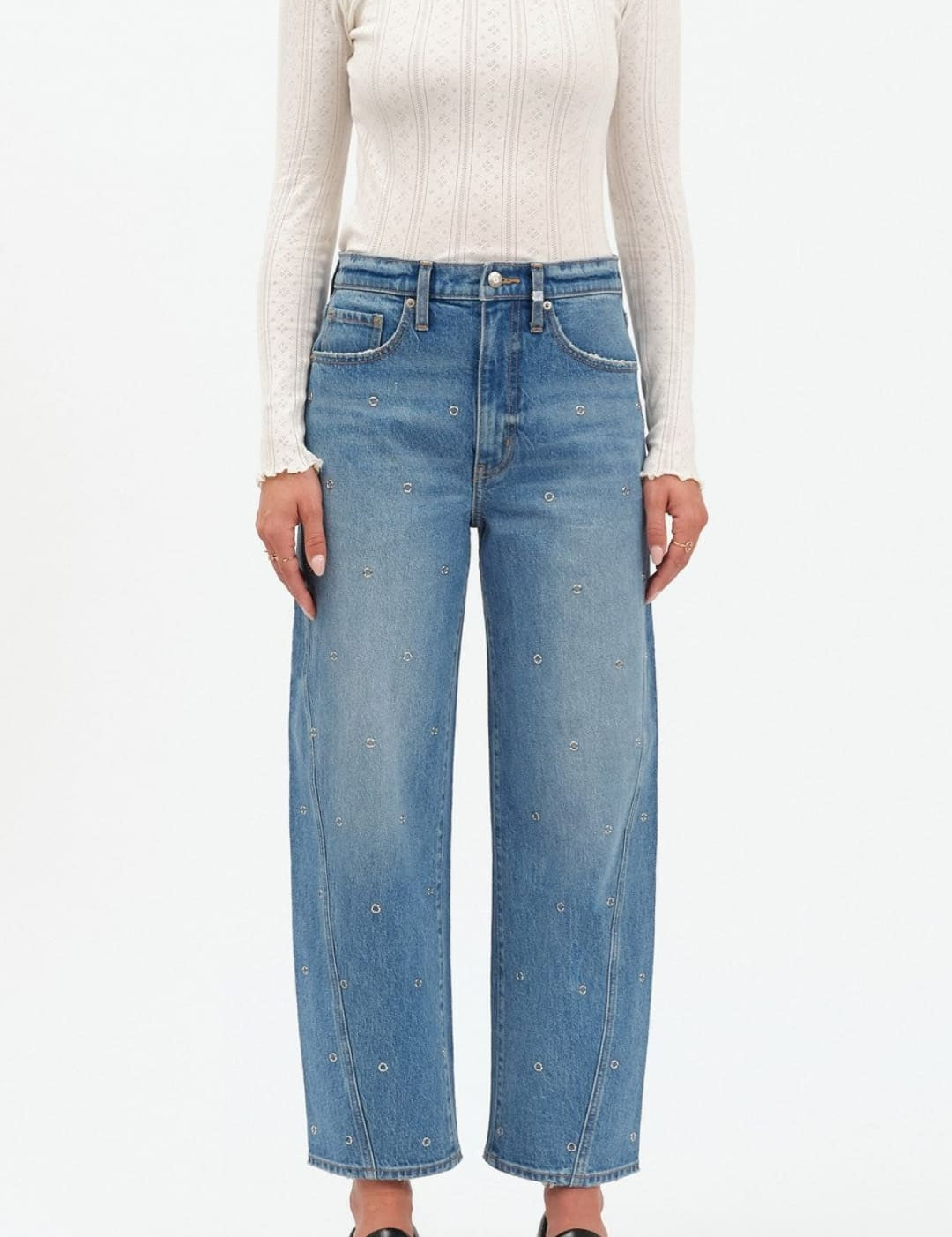 Light blue high-waisted jeans with distressed details and a straight leg fit, likely from levi’s 501 model.