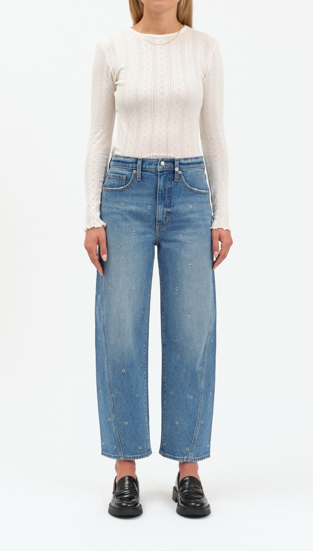 Light blue high-waisted jeans with distressed details and a straight leg fit, likely from levi’s 501 model.
