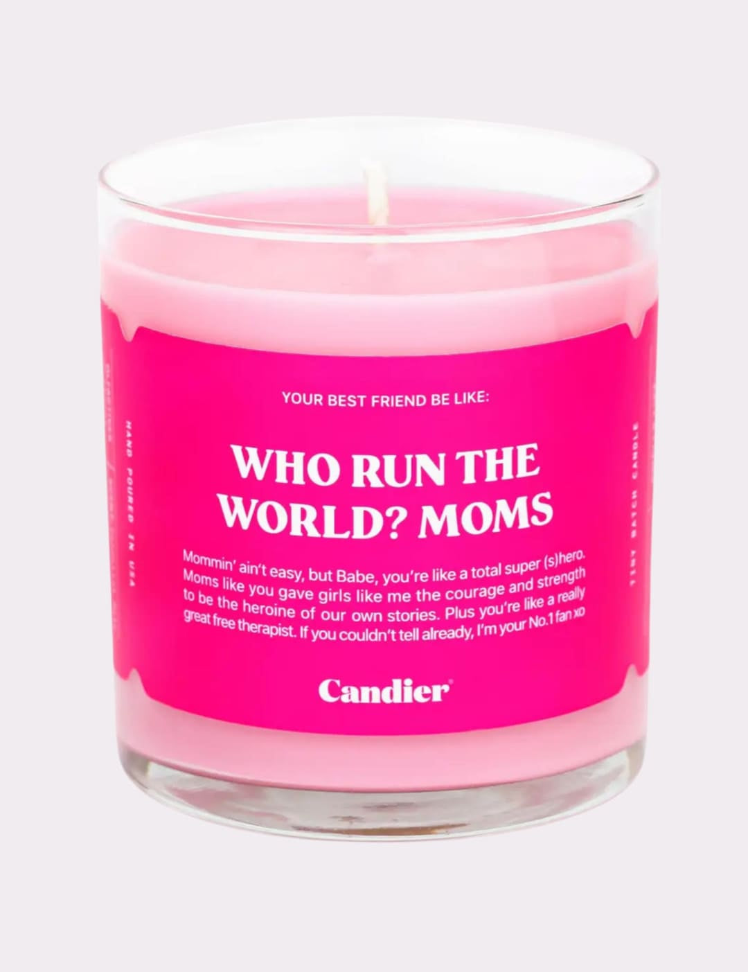 Pink candle in a clear glass jar.