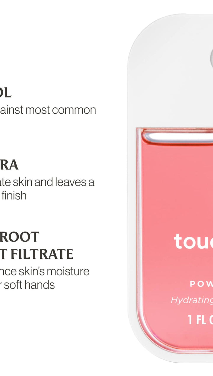 Pink and white hand sanitizer bottle with a pump dispenser, labeled ’touchland power mist’