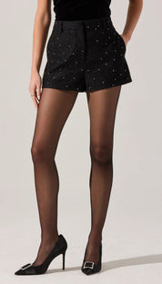 Black high-waisted shorts with scattered white embellishments.