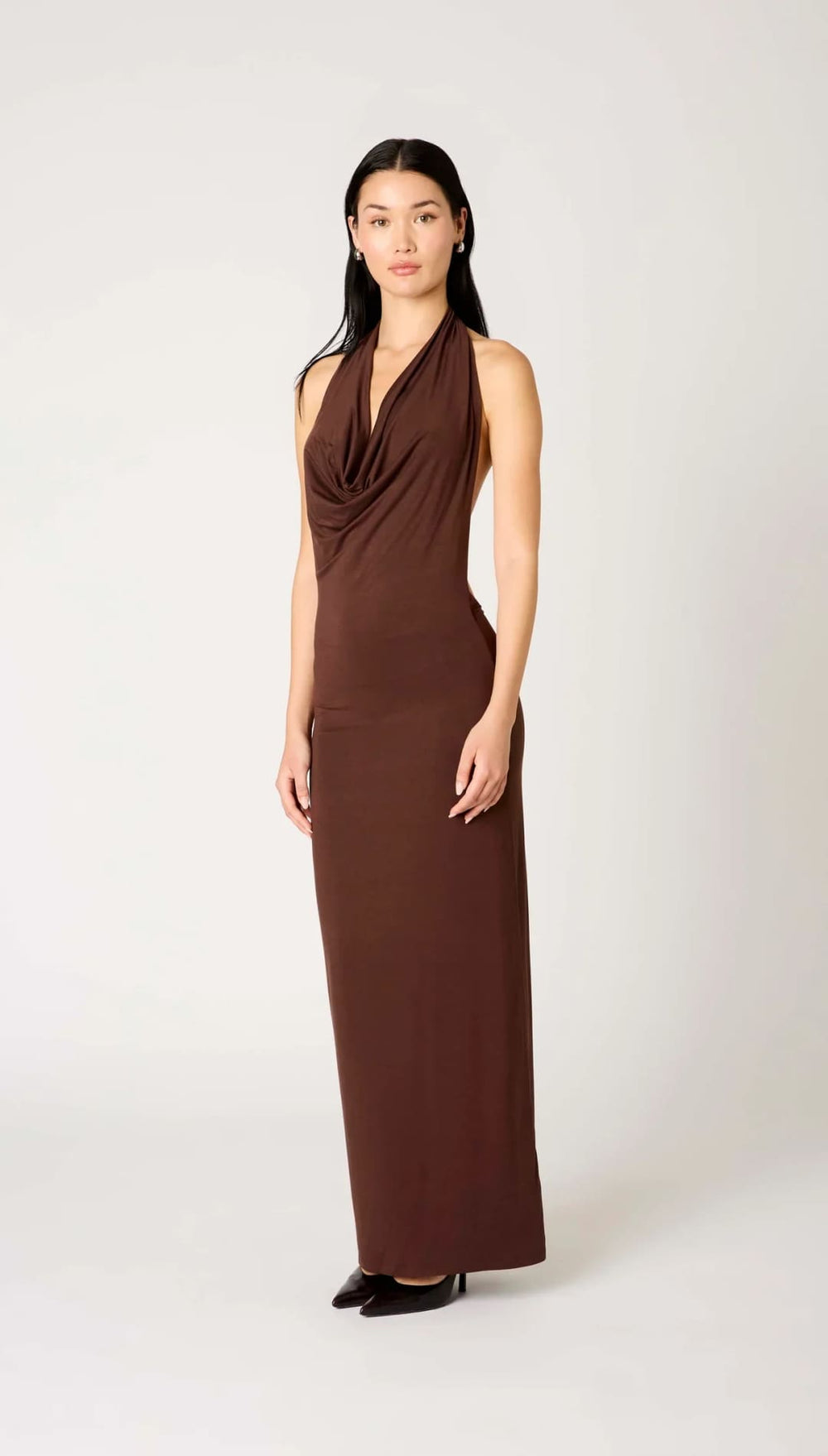 Chocolate brown draped halter neck maxi dress with a sleek jersey material and minimalist design.