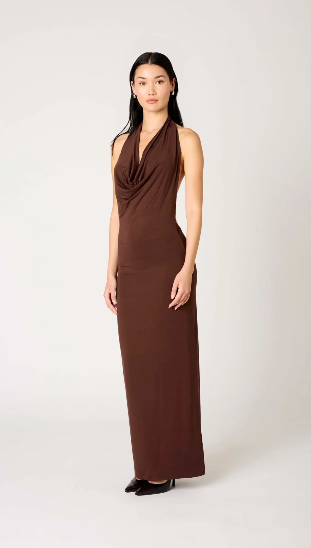 Chocolate brown draped halter neck maxi dress with a sleek jersey material and minimalist design.