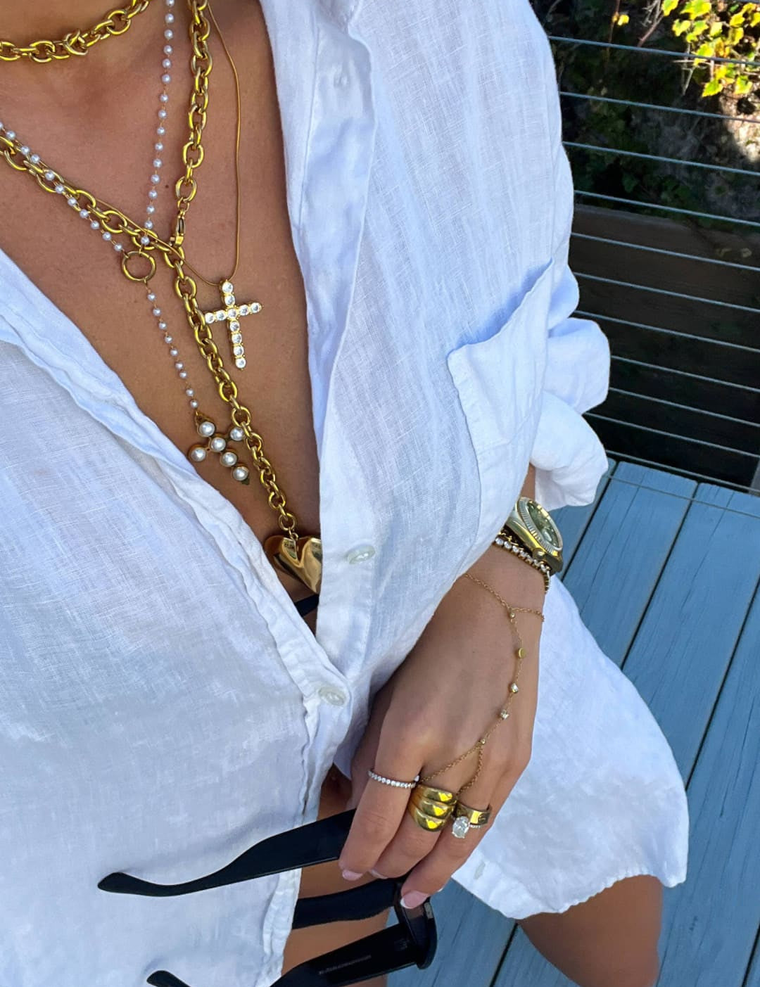Gold chain necklace with pearls and a cross pendant