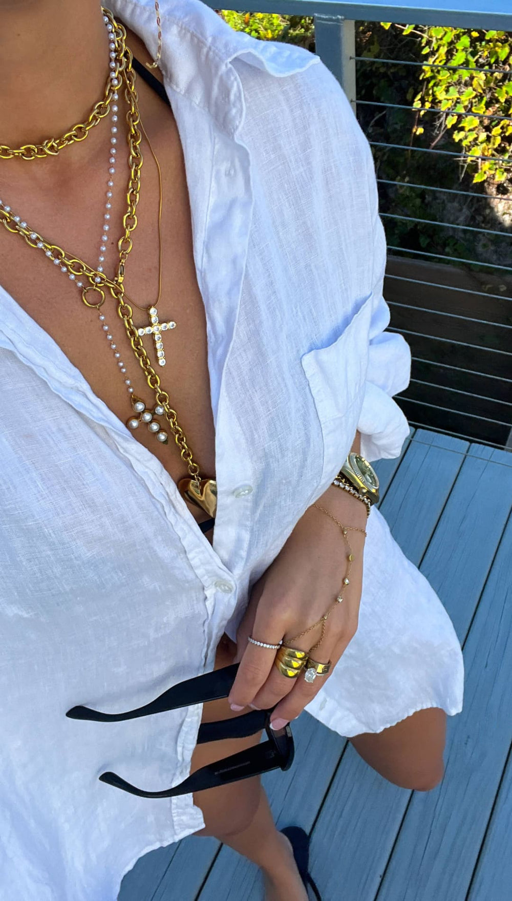 Gold chain necklace with pearls and a cross pendant