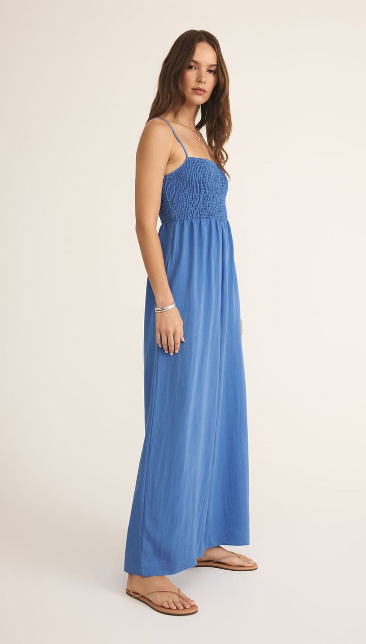 Blue maxi dress with spaghetti straps.