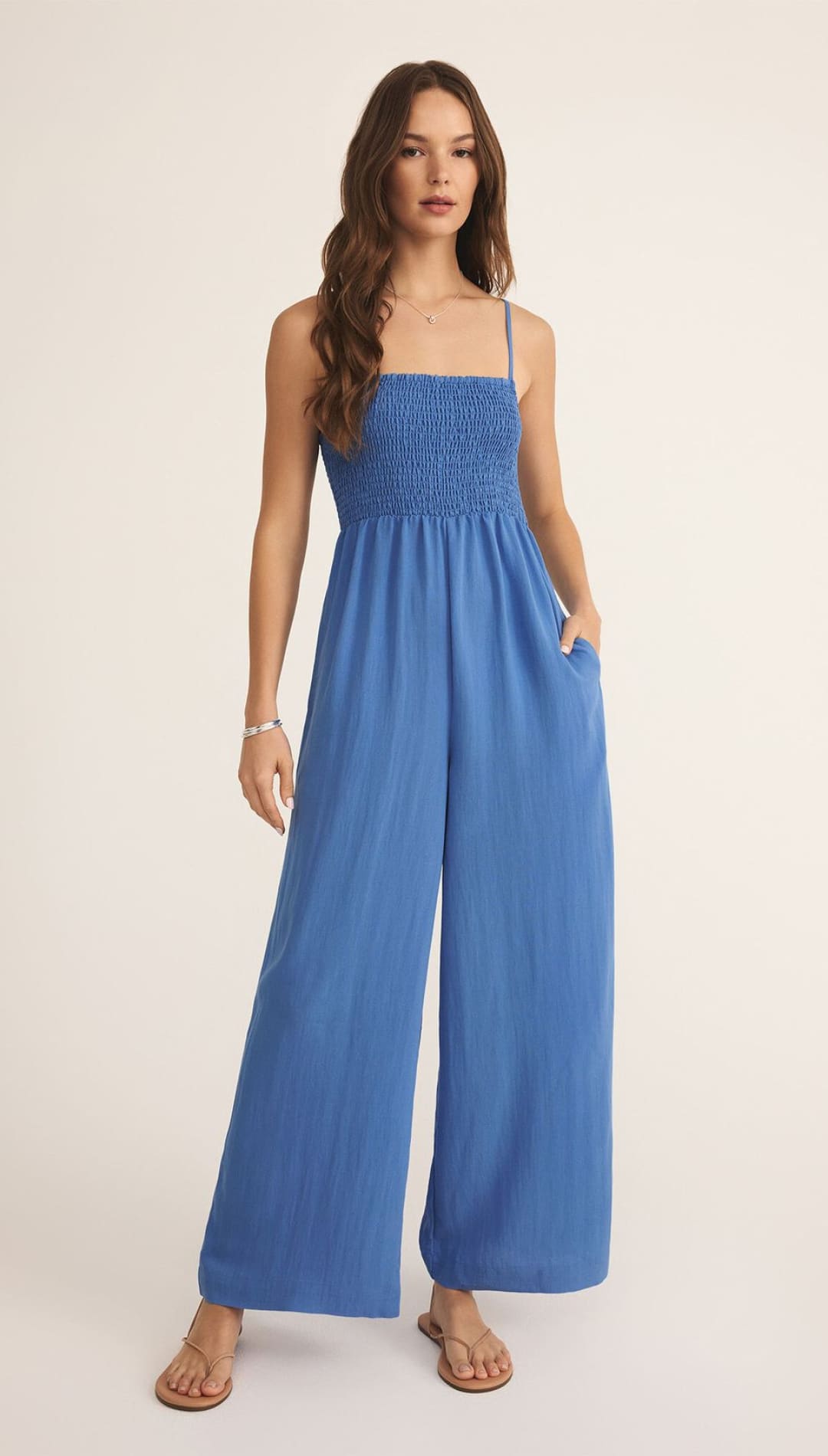 Blue smocked jumpsuit.