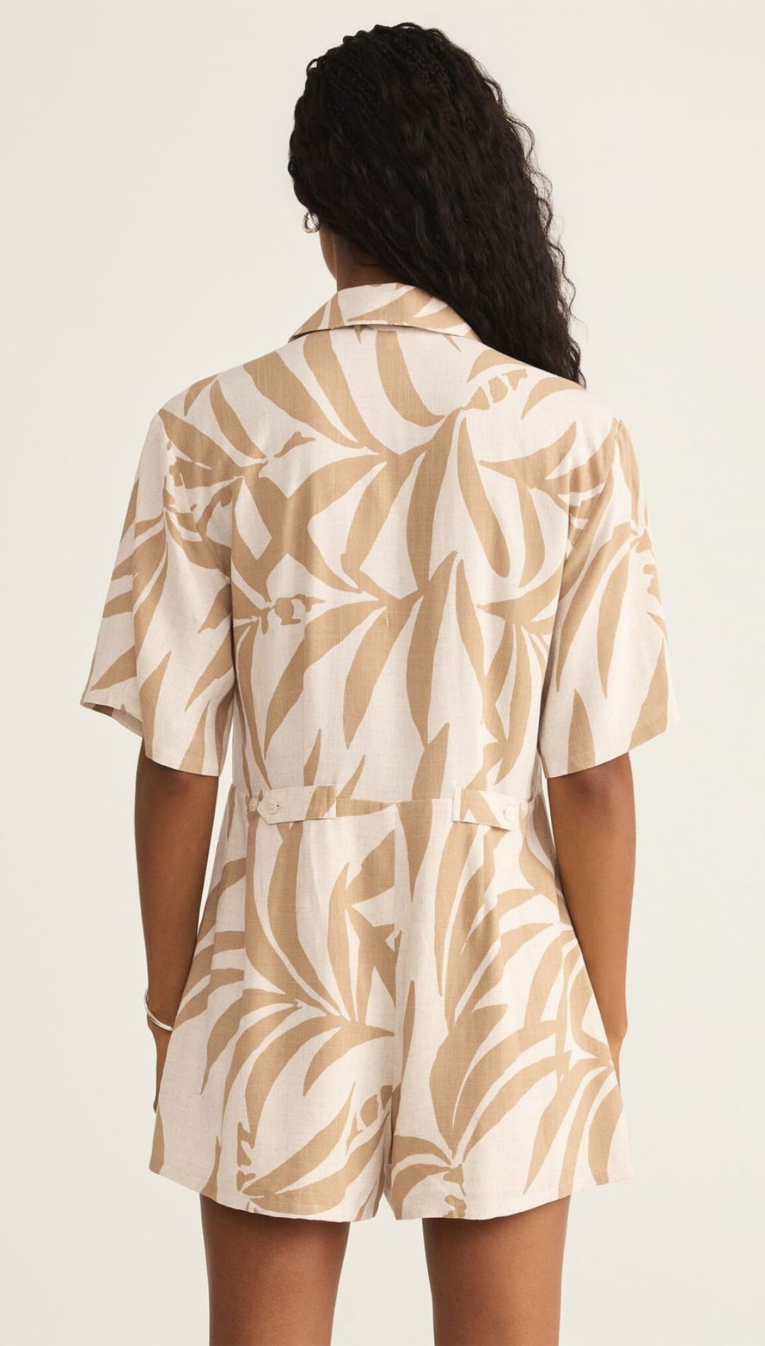 Leaf-patterned romper.