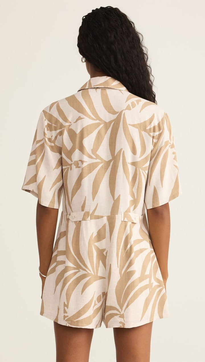 Leaf-patterned romper.