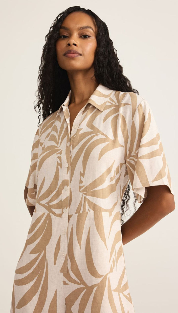 Leaf-patterned collared dress.