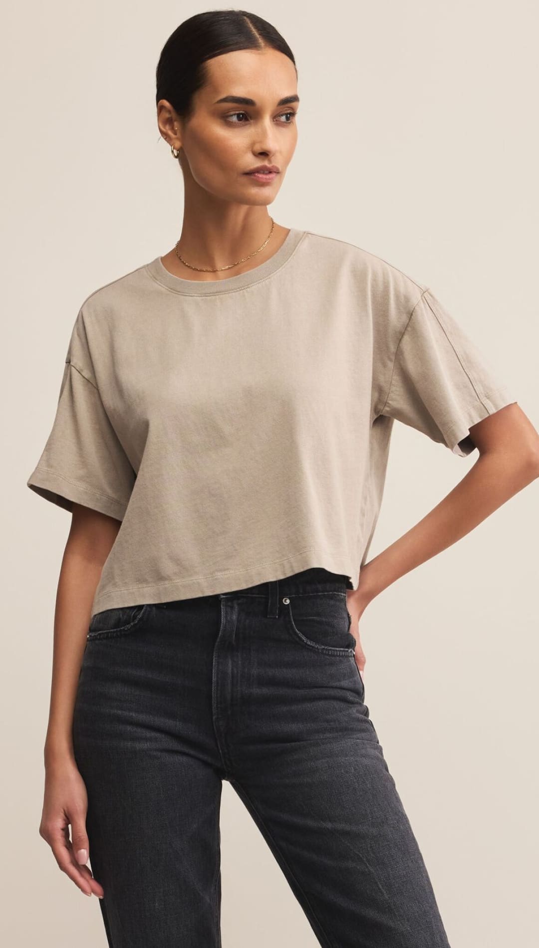 A beige, short-sleeved, cropped t-shirt.