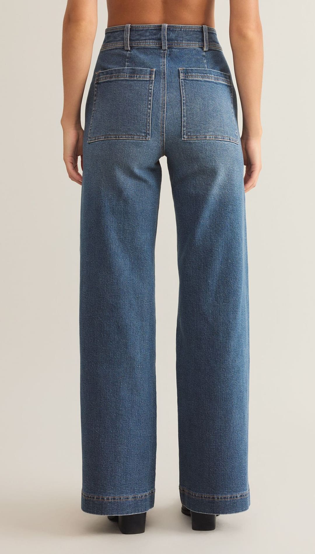 Women’s high-waisted, wide-leg blue jeans with back pockets.