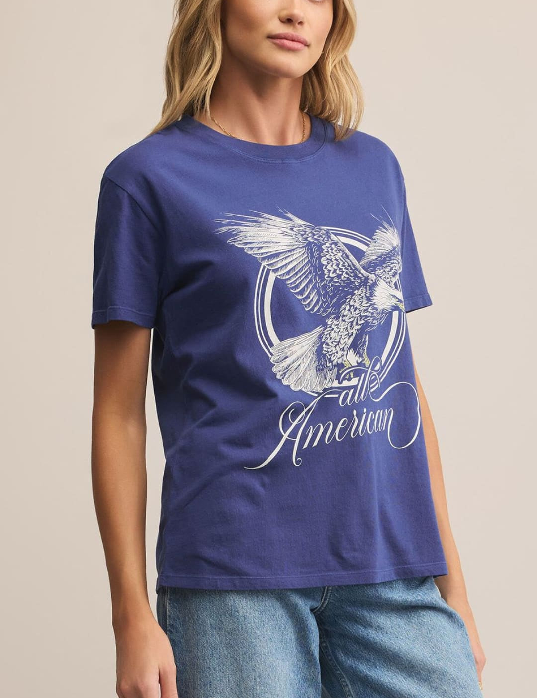 Women’s short-sleeved blue t-shirt with an eagle graphic and ’all American’ text.