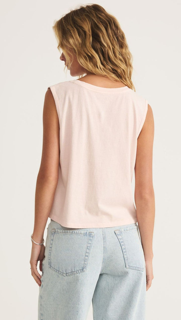 Light pink sleeveless top.