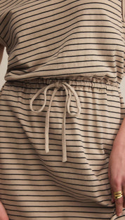 A beige and black striped midi-dress with a drawstring waist.