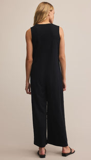 Black sleeveless jumpsuit with wide-leg design and button detail down the back.