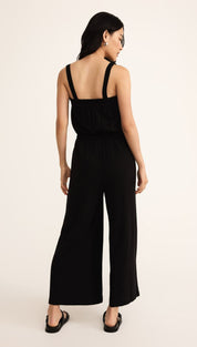 Black sleeveless wide-leg jumpsuit.